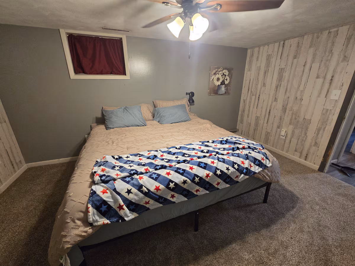 Bedroom with a king bed at The Cozy Cottage