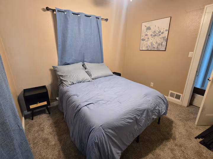 Bedroom with a double bed at The Cozy Cottage